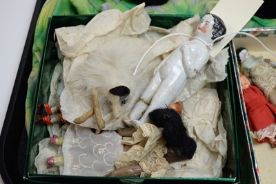 Lot 387 - A collection of antique dolls, doll parts and accessories
