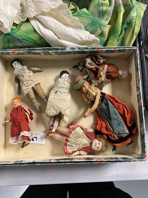 Lot 387 - A collection of antique dolls, doll parts and accessories