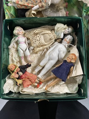 Lot 387 - A collection of antique dolls, doll parts and accessories