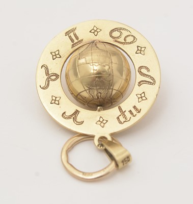 Lot 123 - An astrological yellow gold globe pendant