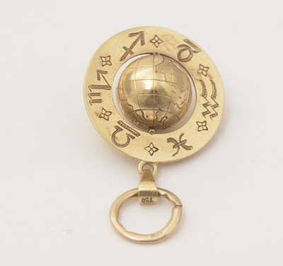 Lot 123 - An astrological yellow gold globe pendant