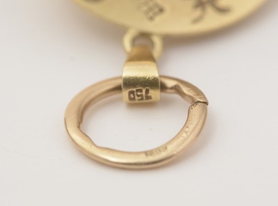 Lot 123 - An astrological yellow gold globe pendant