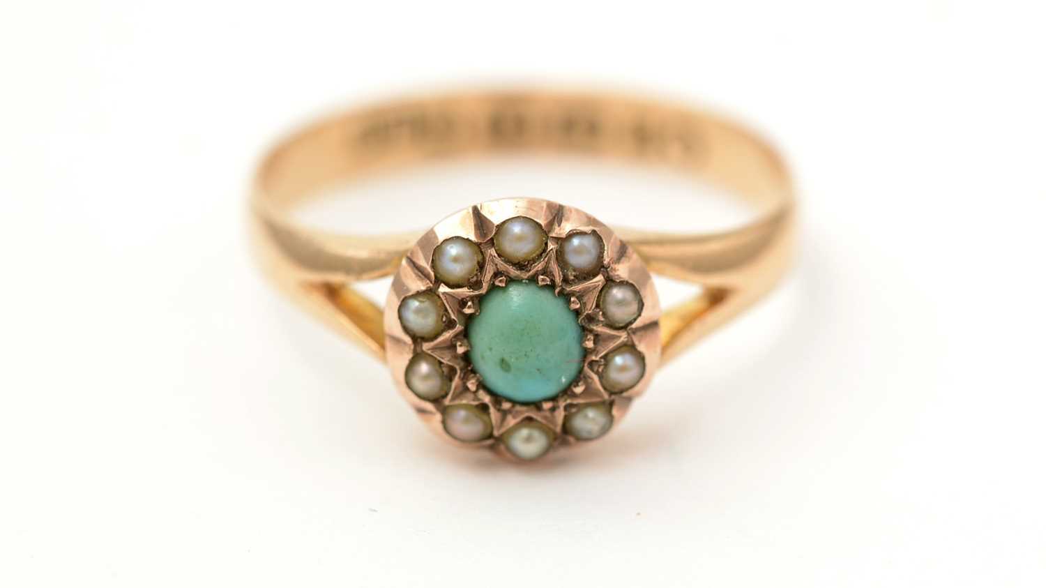 Lot 135 - A Victorian turquoise and seed pearl cluster ring