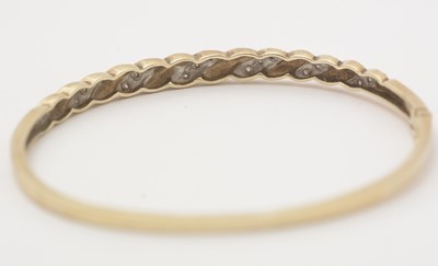 Lot 139 - A diamond and 9ct yellow gold bangle