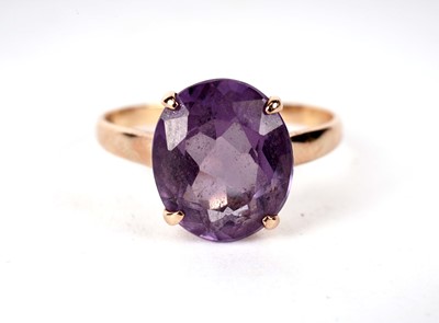 Lot 420 - A synthetic colour change sapphire dress ring; and another