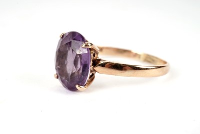 Lot 420 - A synthetic colour change sapphire dress ring; and another