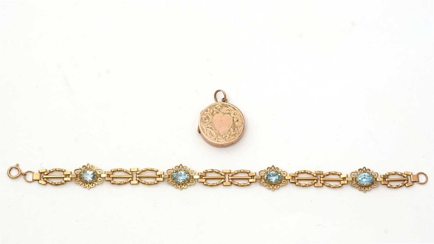 Lot 172 - An light blue topaz and 9ct yellow gold bracelet; and a locket