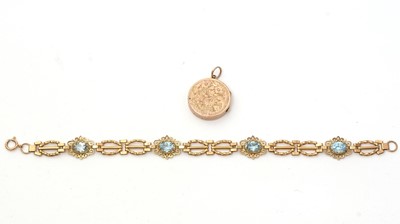 Lot 172 - An light blue topaz and 9ct yellow gold bracelet; and a locket