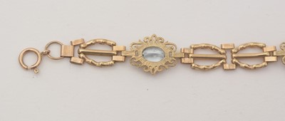 Lot 172 - An light blue topaz and 9ct yellow gold bracelet; and a locket