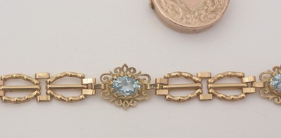 Lot 172 - An light blue topaz and 9ct yellow gold bracelet; and a locket