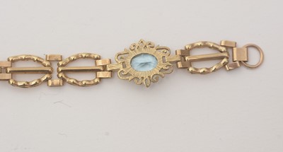Lot 172 - An light blue topaz and 9ct yellow gold bracelet; and a locket