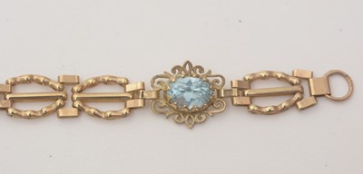 Lot 172 - An light blue topaz and 9ct yellow gold bracelet; and a locket