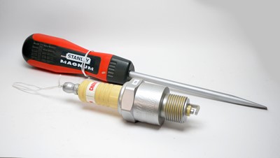 Lot 755 - Model Stanley Magnum screwdriver and Champion spark plug