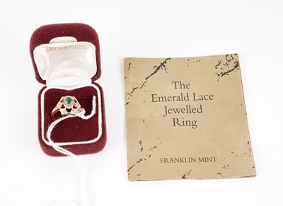 Lot 425 - An emerald and diamond dress ring