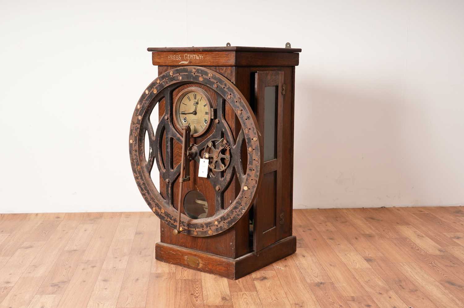 Lot 9 - An Edwardian oak checking-in clock by The International Time Recording Co Ltd