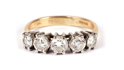 Lot 1131 - A five stone diamond ring