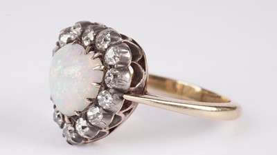 Lot 1198 - A Victorian opal and diamond heart-shaped ring