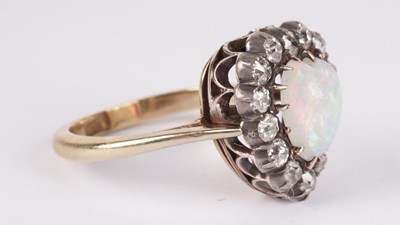 Lot 1198 - A Victorian opal and diamond heart-shaped ring