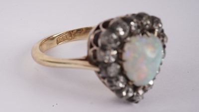 Lot 1198 - A Victorian opal and diamond heart-shaped ring