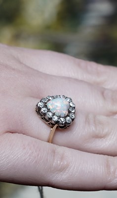 Lot 1198 - A Victorian opal and diamond heart-shaped ring