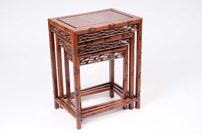 Lot 741 - A Chinese hardwood nest of tables