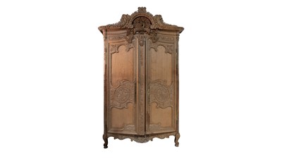 Lot 978 - A large and impressive French provincial style carved light oak armoire