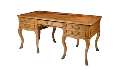 Lot 979 - A large French light oak writing desk