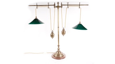 Lot 911 - A vintage brass twin rise and fall pulley lamp