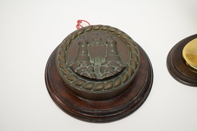 Lot 376 - A cast bronze ships tampion and a lacquered brass Spitfire
