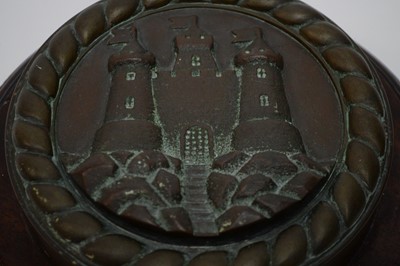 Lot 376 - A cast bronze ships tampion and a lacquered brass Spitfire