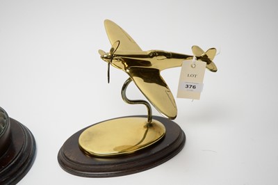 Lot 376 - A cast bronze ships tampion and a lacquered brass Spitfire