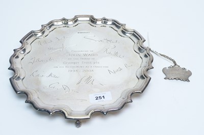 Lot 251 - A silver presentation salver; and a decanter label