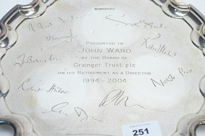 Lot 251 - A silver presentation salver; and a decanter label