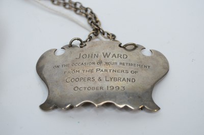 Lot 251 - A silver presentation salver; and a decanter label