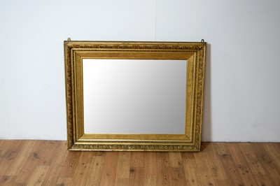 Lot 81 - A reproduction gilt framed wall mirror