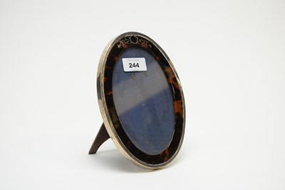 Lot 244 - An early 20th Century silver and tortoiseshell photograph frame
