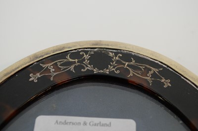Lot 244 - An early 20th Century silver and tortoiseshell photograph frame