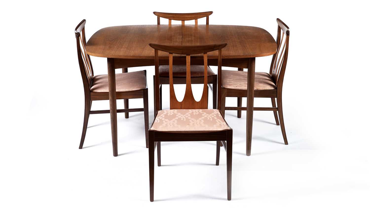 Lot 62 - E Gomme for G Plan: A retro teak extending dining table and four chairs