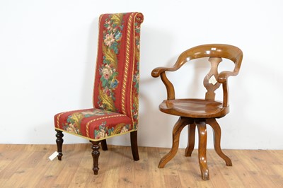 Lot 52 - A 20th Century swivel action oak Captains chair with a decorative prie dieu chair
