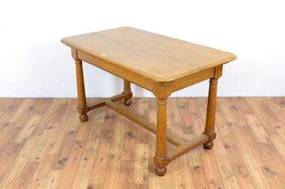 Lot 55 - A 20th Century oak writing desk
