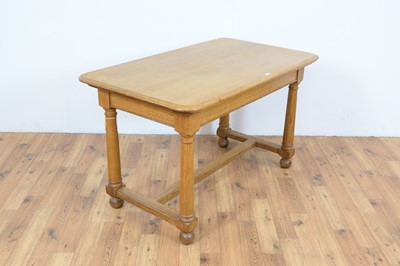 Lot 55 - A 20th Century oak writing desk
