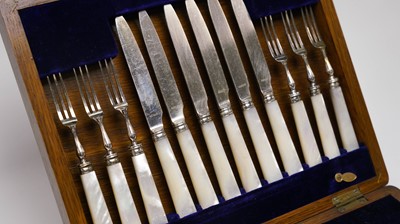Lot 110 - An early 20th Century walnut canteen of cutlery