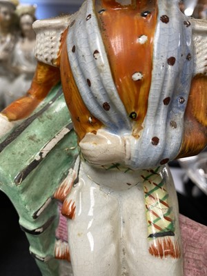 Lot 93 - A selection of Staffordshire ceramic flatback figures