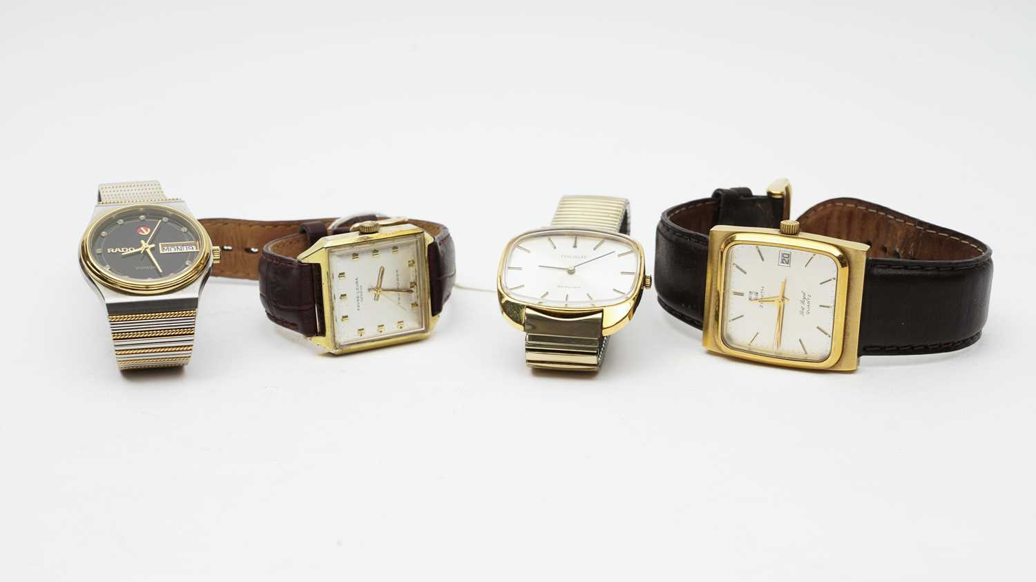 Lot 432 - Four wristwatches by Rado, Tissot,