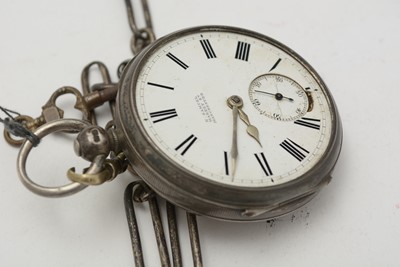 Lot 429 - A silver case open-faced pocket watch and chains