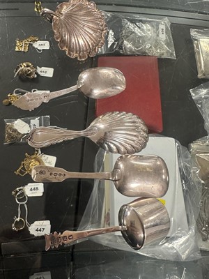 Lot 407 - A Victorian silver Lily pattern caddy spoon; and four others