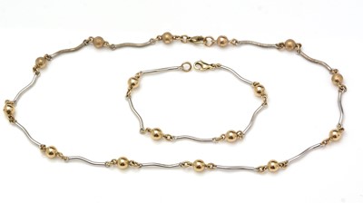 Lot 480 - A 9ct yellow and white gold matching bracelet and necklace