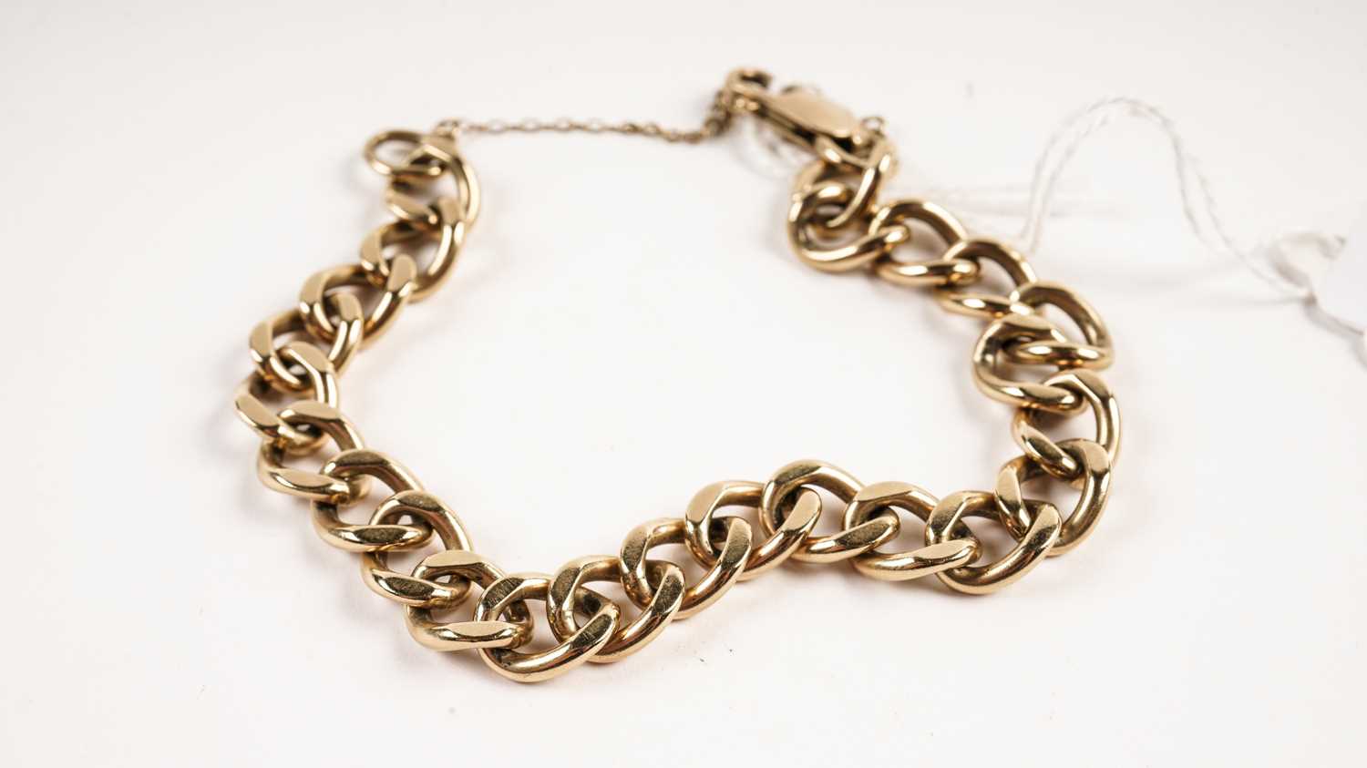 Lot 483 - A 9ct yellow gold curb link bracelet