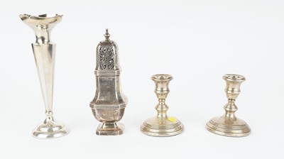 Lot 404 - Silver caster, vase and candlesticks