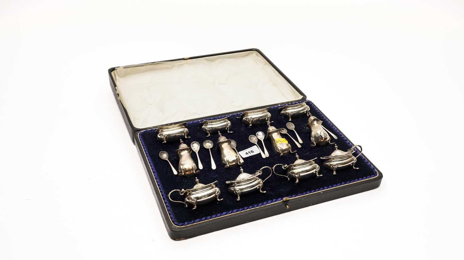 Lot 416 - An extensive silver condiment set, by Reid & Sons